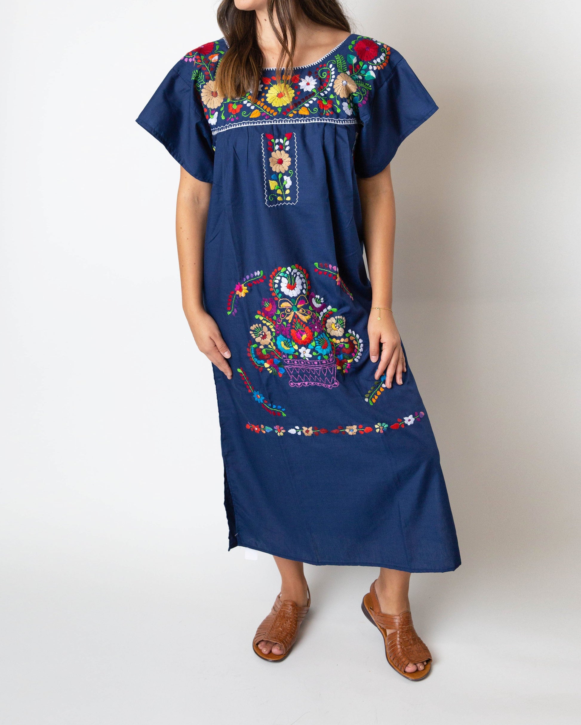 Navy blue Mexican embroidered Pueblo dress with colorful hand-stitched floral details